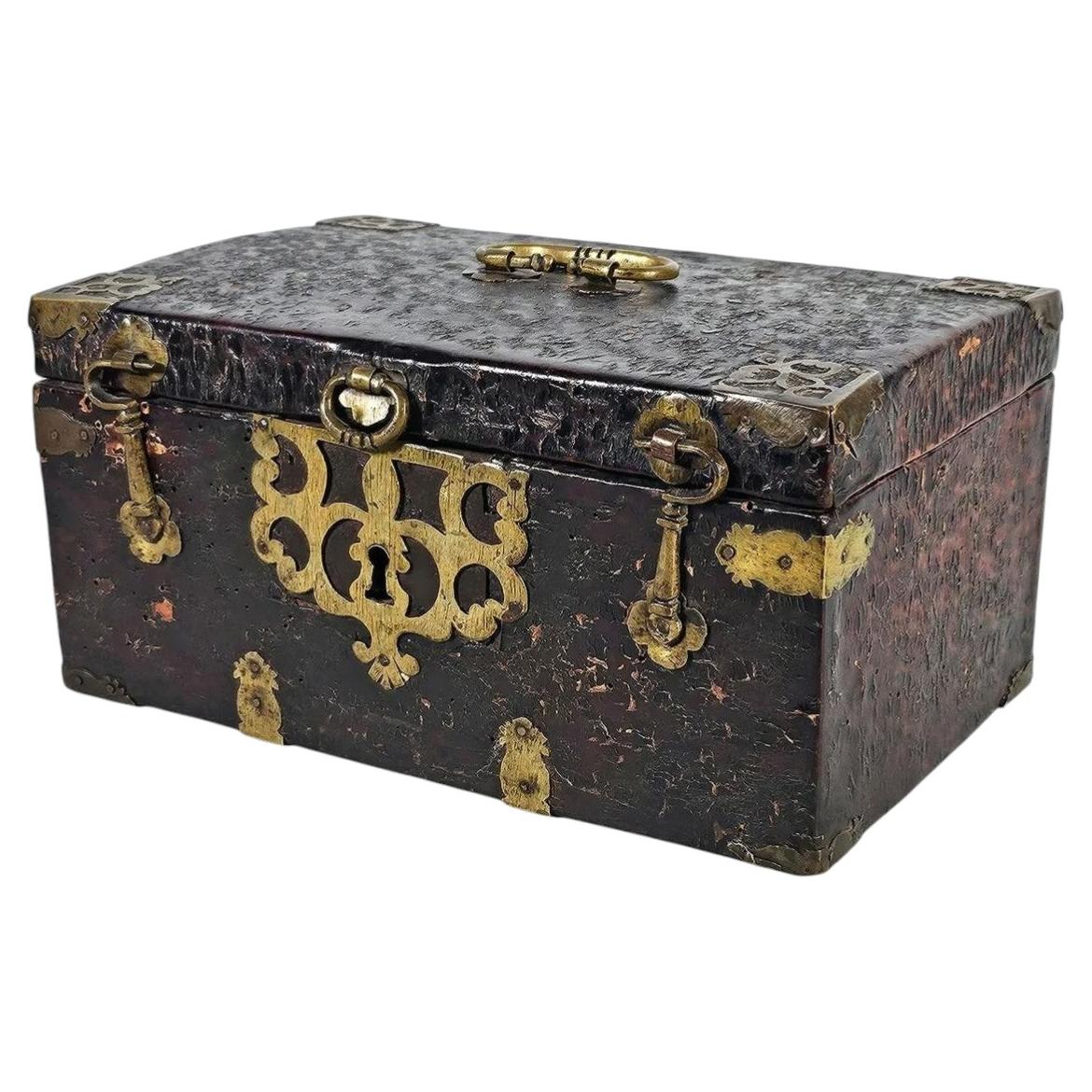 Antique 18th century European leather and brass casket angled view curated by Le Historique