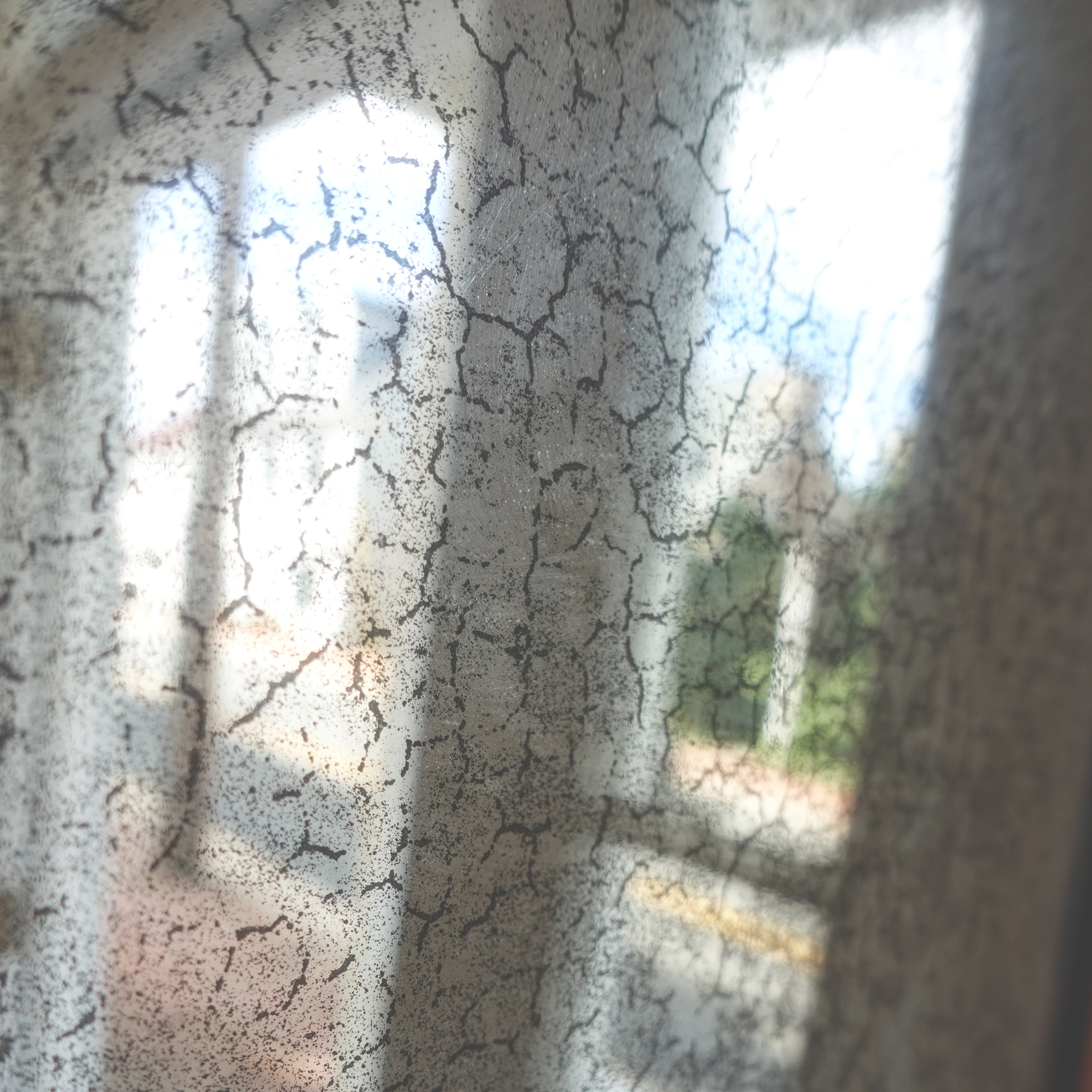 Close-up of dendritic silvering loss and fine crazing on an antique Edwardian mirror, Le Historique.