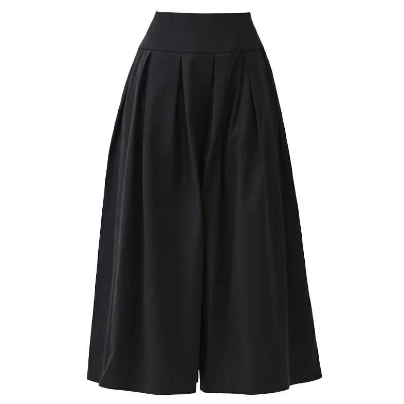 Studio shot of a black 100% cotton pleated midi skirt, featuring a structured wide waistband and deep, symmetrical pleats for a timeless, well-constructed silhouette.