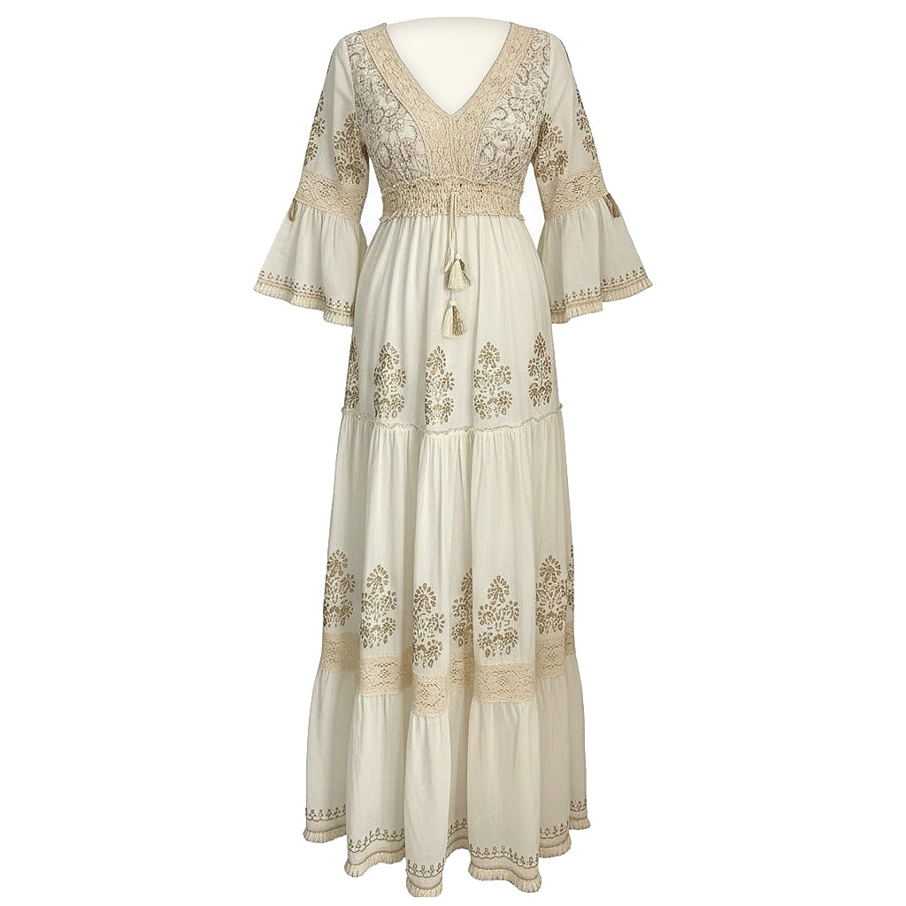 Beige embroidered dress on a white background
