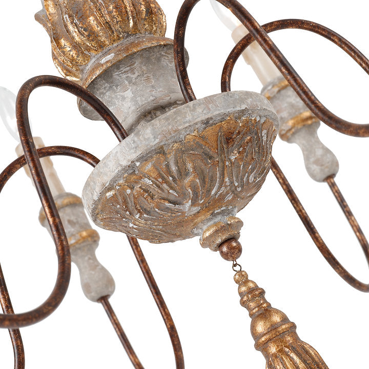 Detail of the Calandra Chandelier by Terracotta Designs featuring an European style antiqued white wash and bronze gold finish.