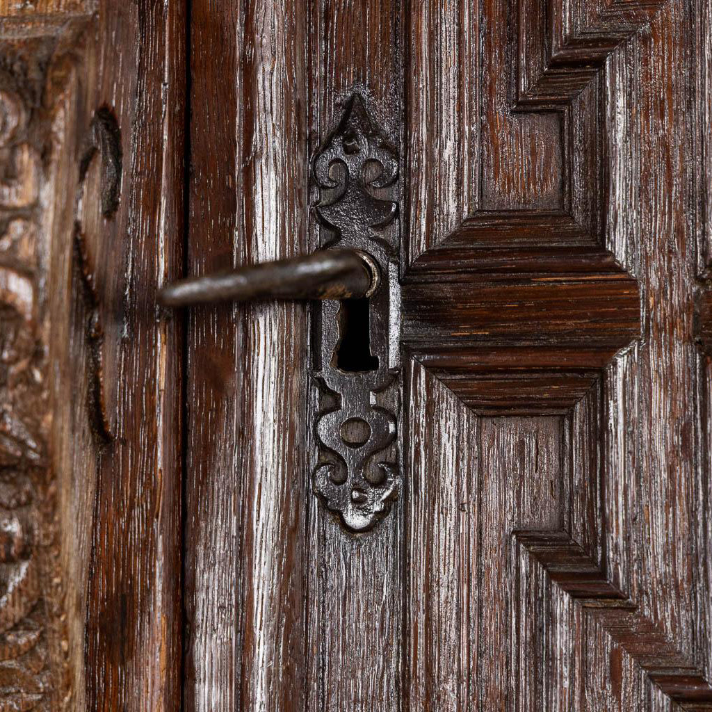 Original 17th century iron lock plates and keys on a monumental European oak cabinet