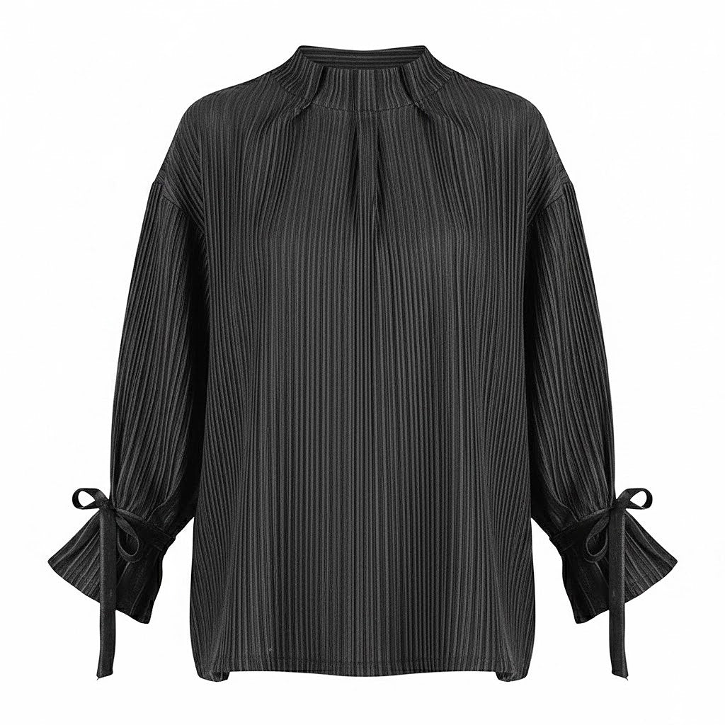 Front view of a loose black and white striped linen shirt with pleated high neck and romantic sleeve ties.
