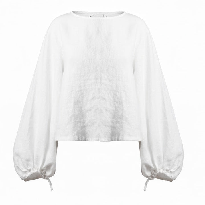 White European linen puff sleeve cropped shirt with minimalist boxy fit and elasticized cuffs on a white background.