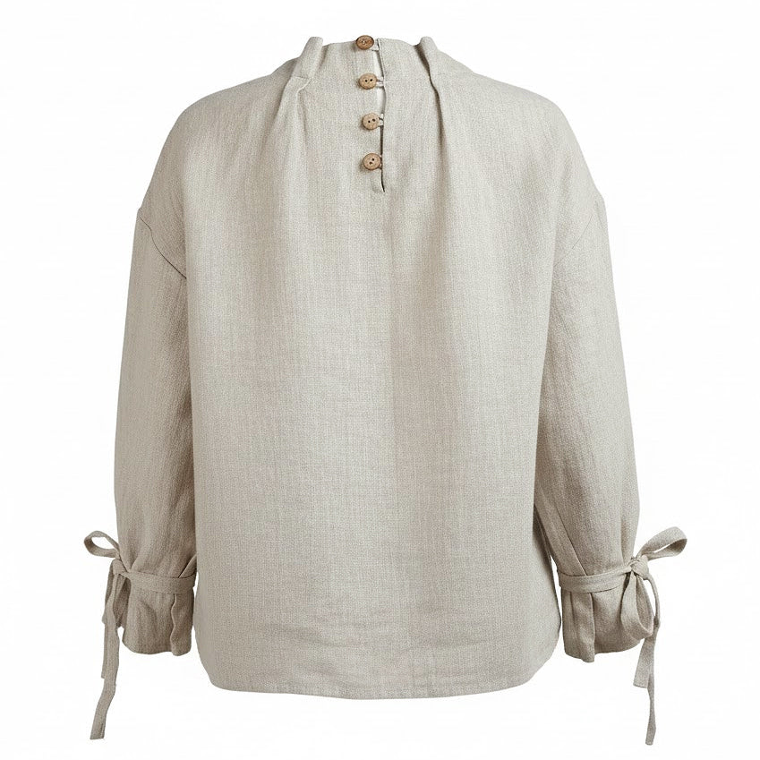 Back view of a sustainable beige linen shirt showing the delicate wooden button closure and high-quality French seams.