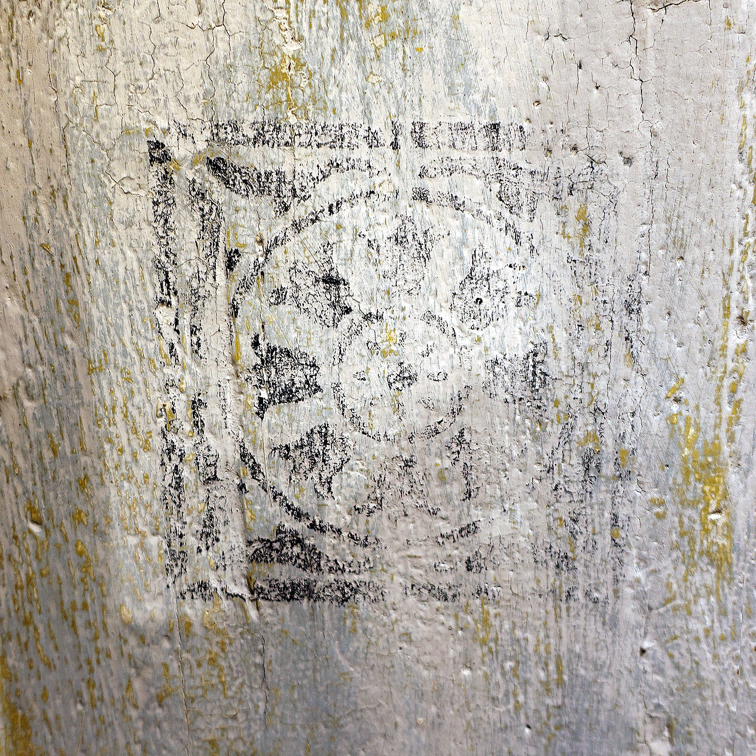 Faded stencil detail on antique Florentine cabinet drawers
