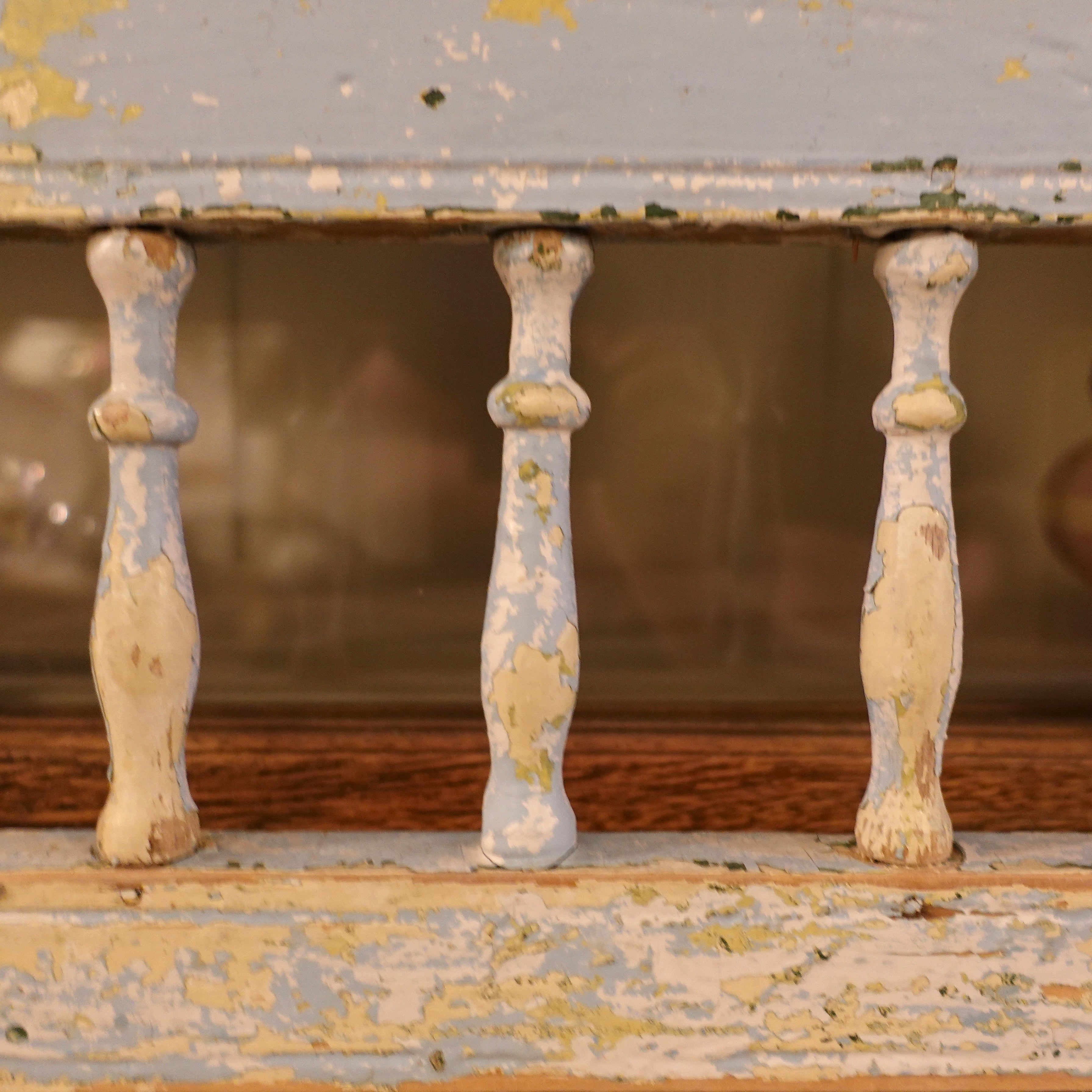 Architectural detail of an authentic Gustavian settee backrest with scalloped edges and fluted spindles, perfect for a layered, transitional classic interior.