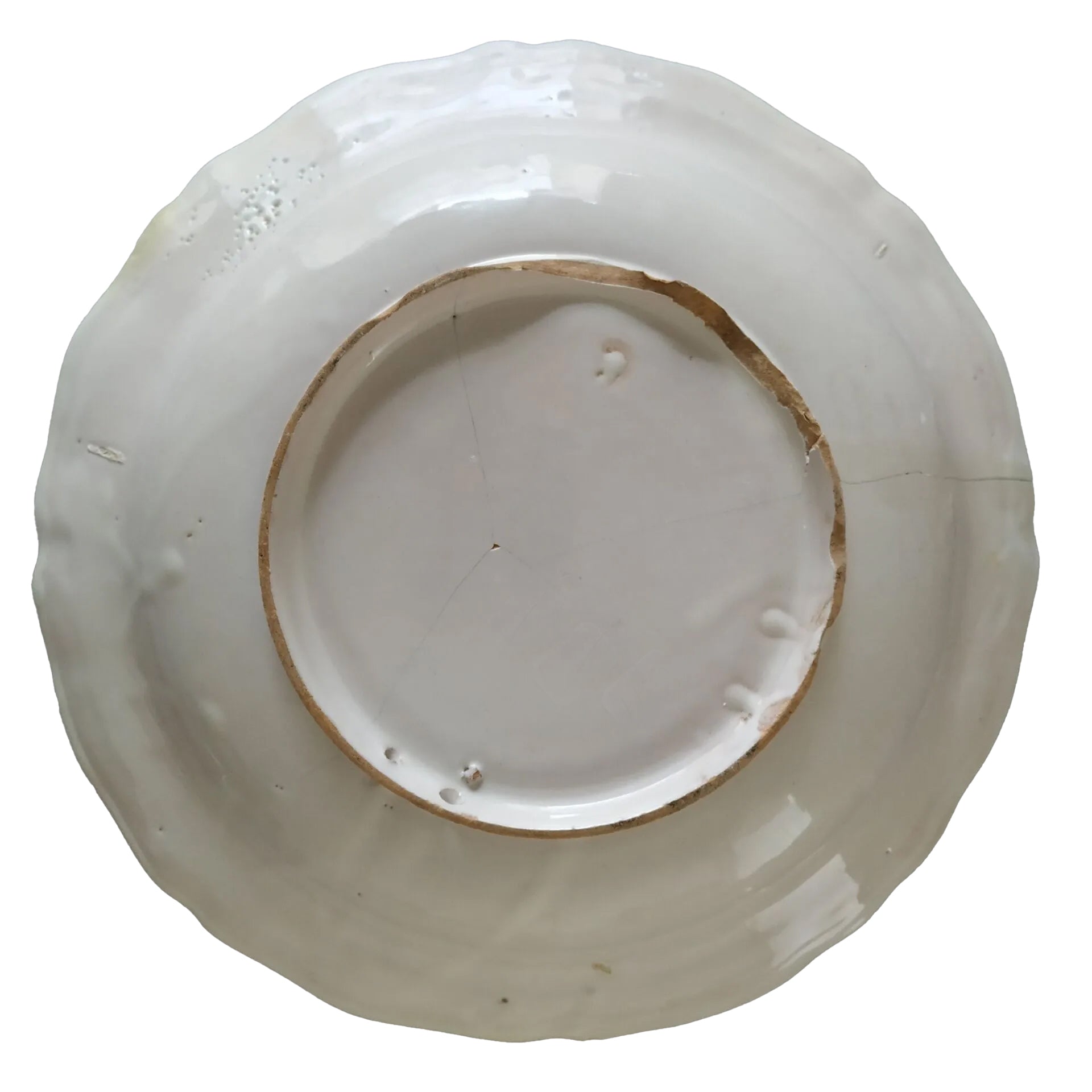 Back of a rare 18th-century French Moustiers Faience earthenware deep plate featuring yellow monochrome ochre grotesque decoration in the style of Jacques Callot, curated by Le Historique.