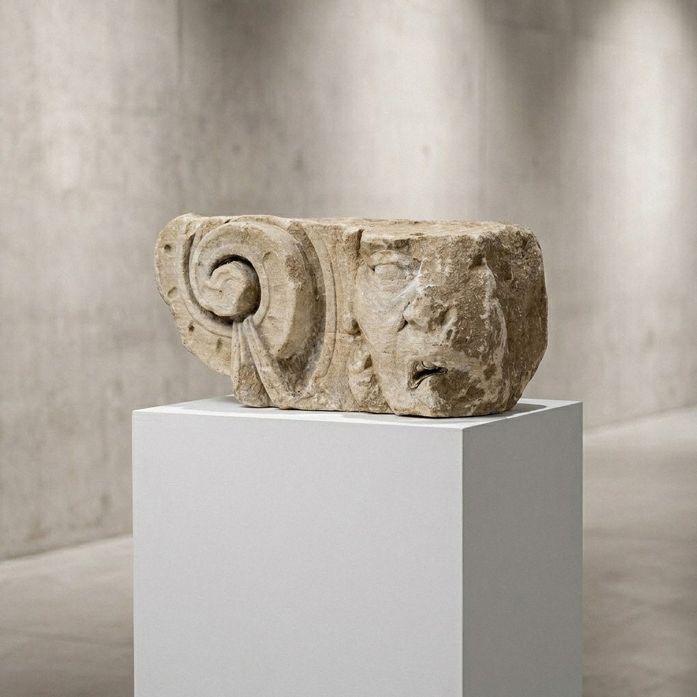 Rare interior modillion carved in the French Renaissance style from Pierre de Caen. This architectural fragment from Rouen (c. 1515–1550) combines a detailed Ionic volute with a chimera grotesque. A curated piece for luxury interiors.