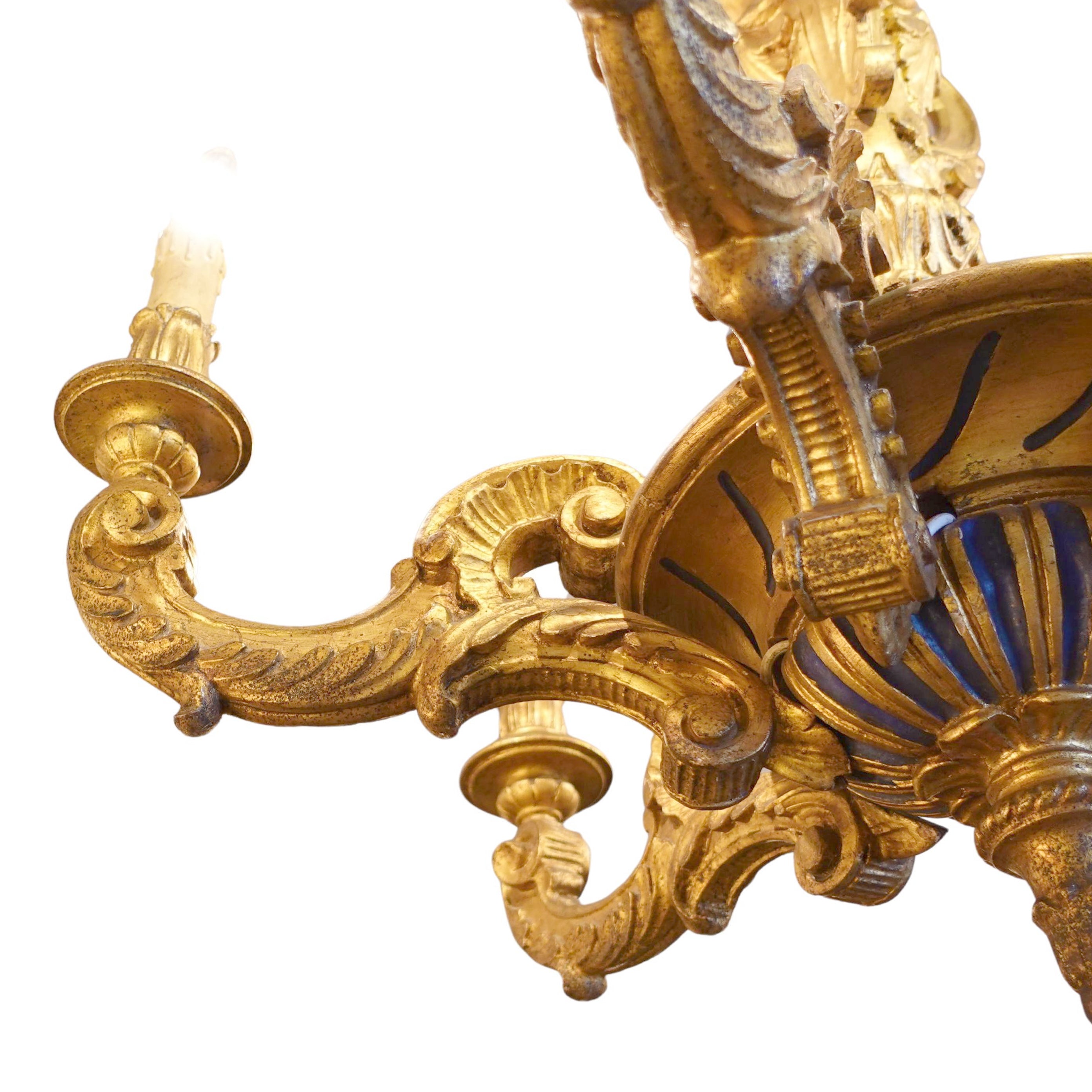 Gold ornate chandelier on a white background