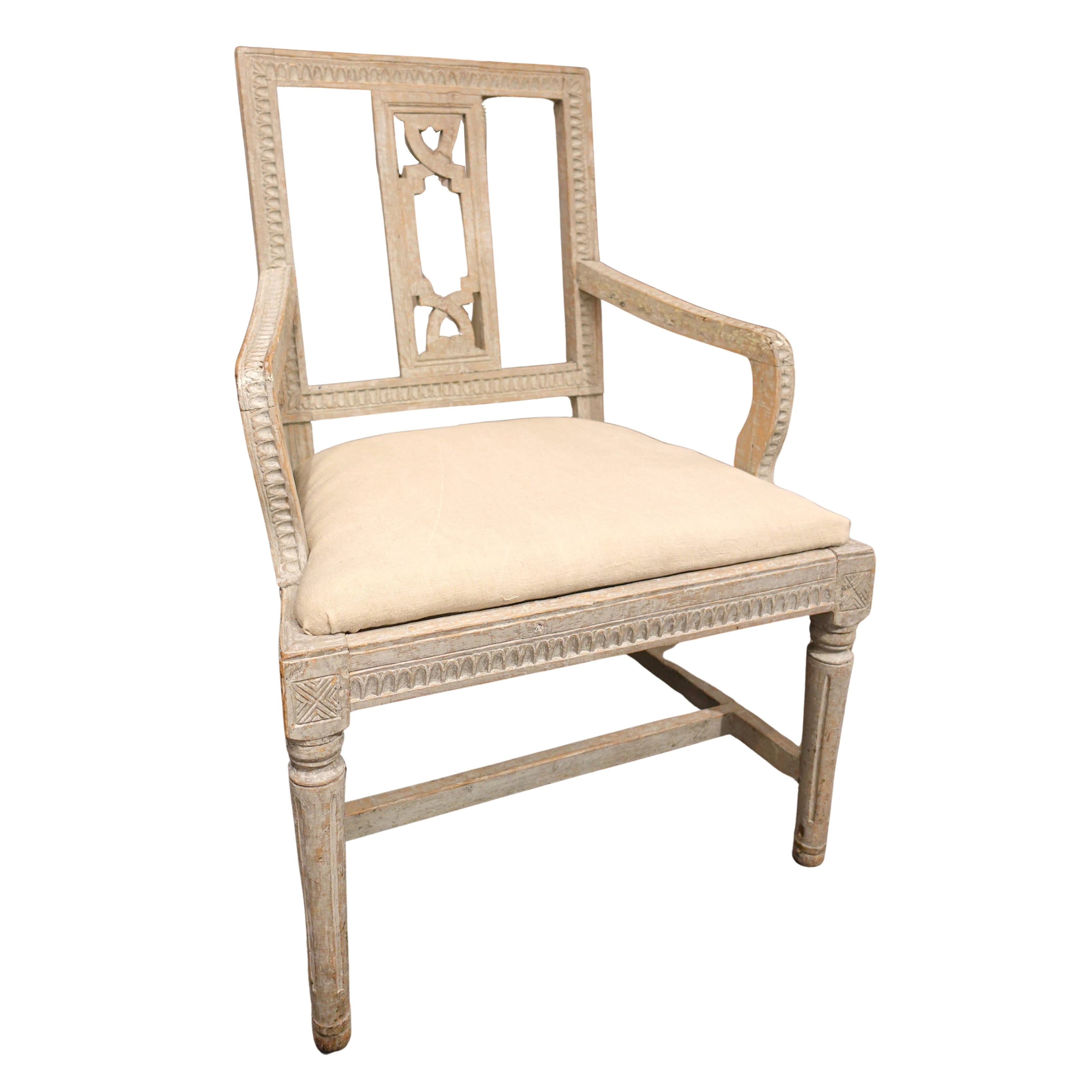 Antique Swedish Gustavian hand-carved time worn accent chair in neutral tones with a linen cushion.