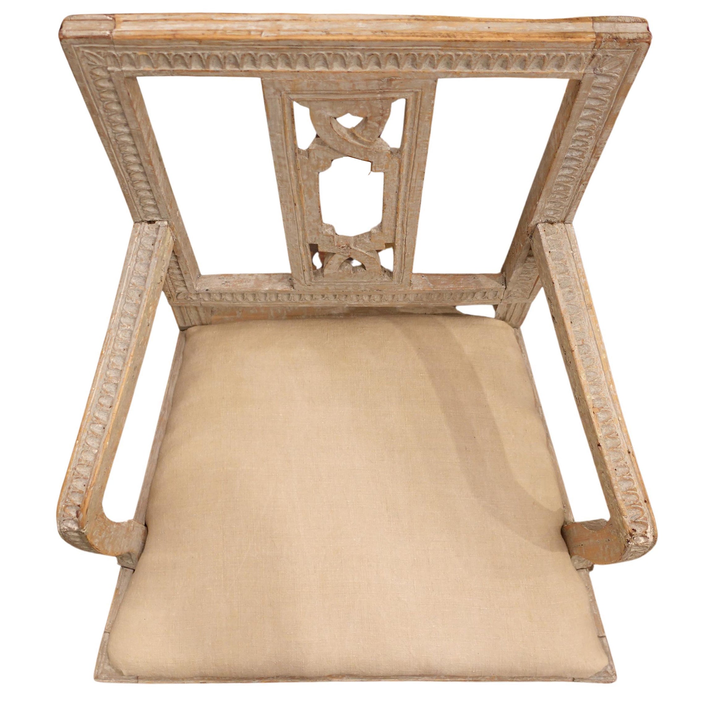Antique Swedish Gustavian hand-carved time worn accent chair in neutral tones with a linen cushion.