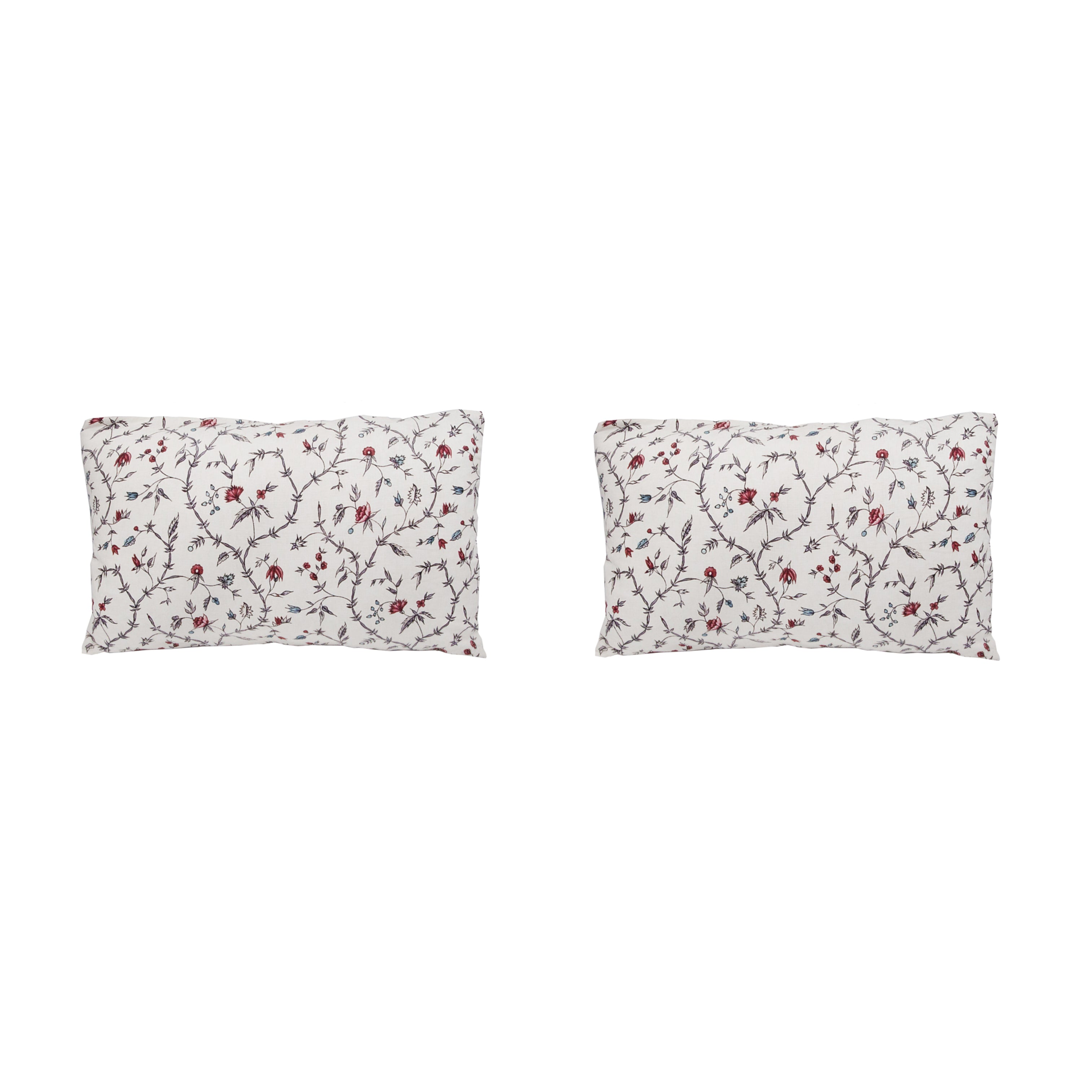 Antoinette Poisson Jardin d’œillets blue and white floral linen pillow on a vintage French bergère chair