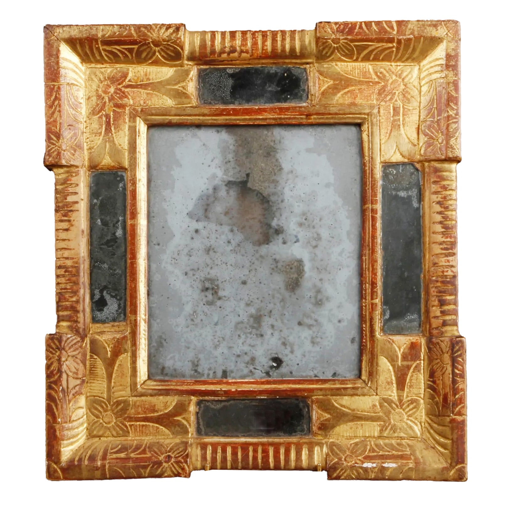 Authentic 17th-century Italian Baroque giltwood cassetta mirror featuring hand-carved floral motifs, red bole patina, and heavily oxidized mercury glass from Le Historique.
