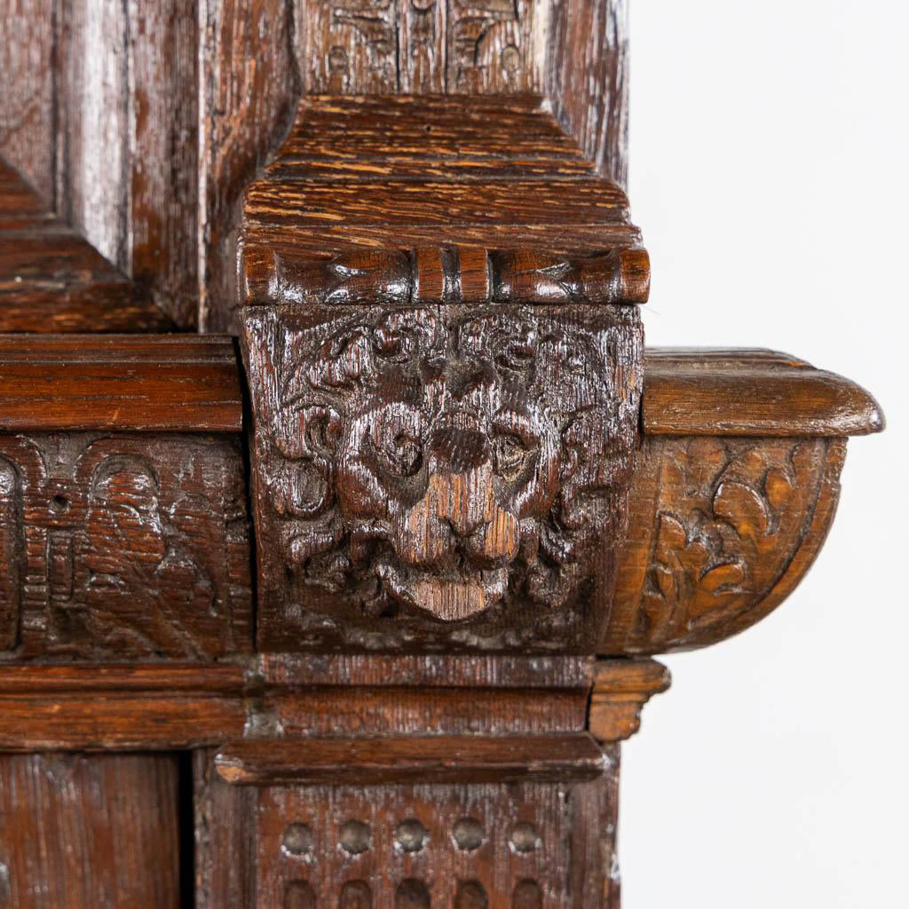 Richly ornamented overhanging cornice of an antique Flemish cabinet for cultural collectors