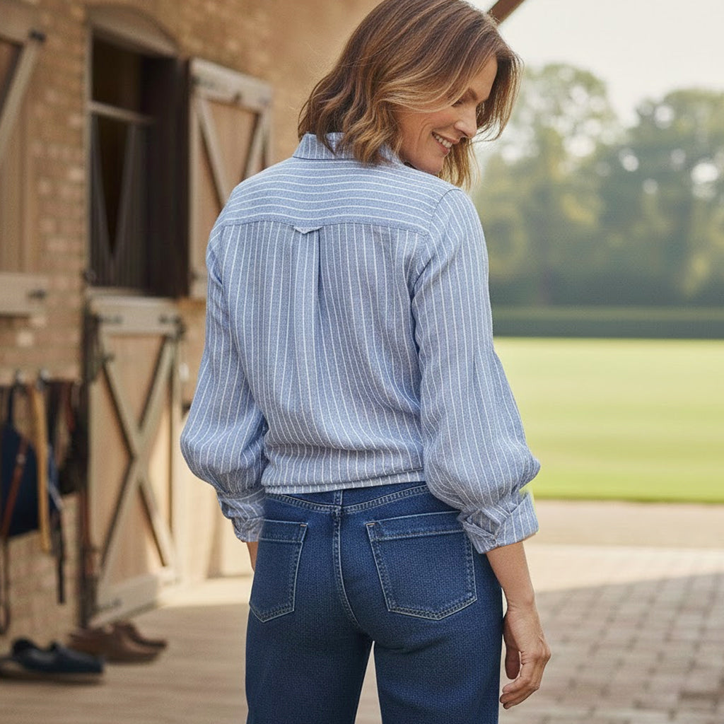 Detailed back view of the Ruth linen shirt showing the back pleat construction and oversized wide sleeves for a romantic, flattering silhouette.