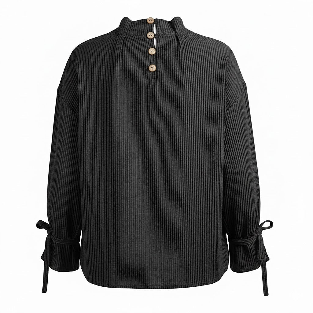 Detailed back view of a handmade European linen shirt featuring a delicate wood button closure and gathered neckline.