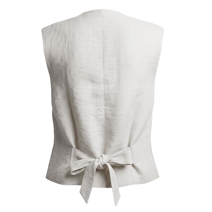 Back detail of pinstripe linen vest featuring adjustable cinch tie for a tailored feminine fit, sustainable heritage style outerwear.