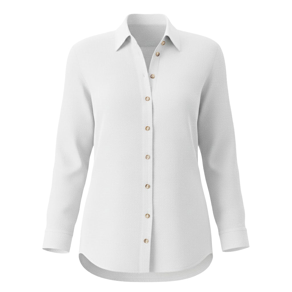 Long sleeve white button down shirt made from 100% European linen with a tailored slouchy silhouette and faux mother-of-pearl buttons.