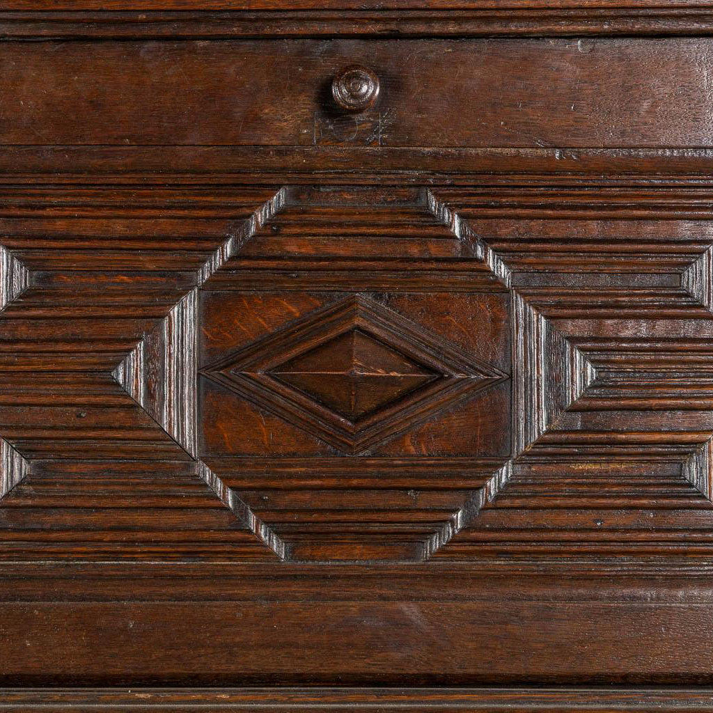 Impressive 18th century oak cabinet with geometric door facades from a fine antique dealer in Loudoun County