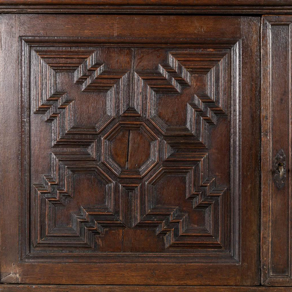 Impressive 18th century oak cabinet with geometric door facades from a fine antique dealer in Loudoun County