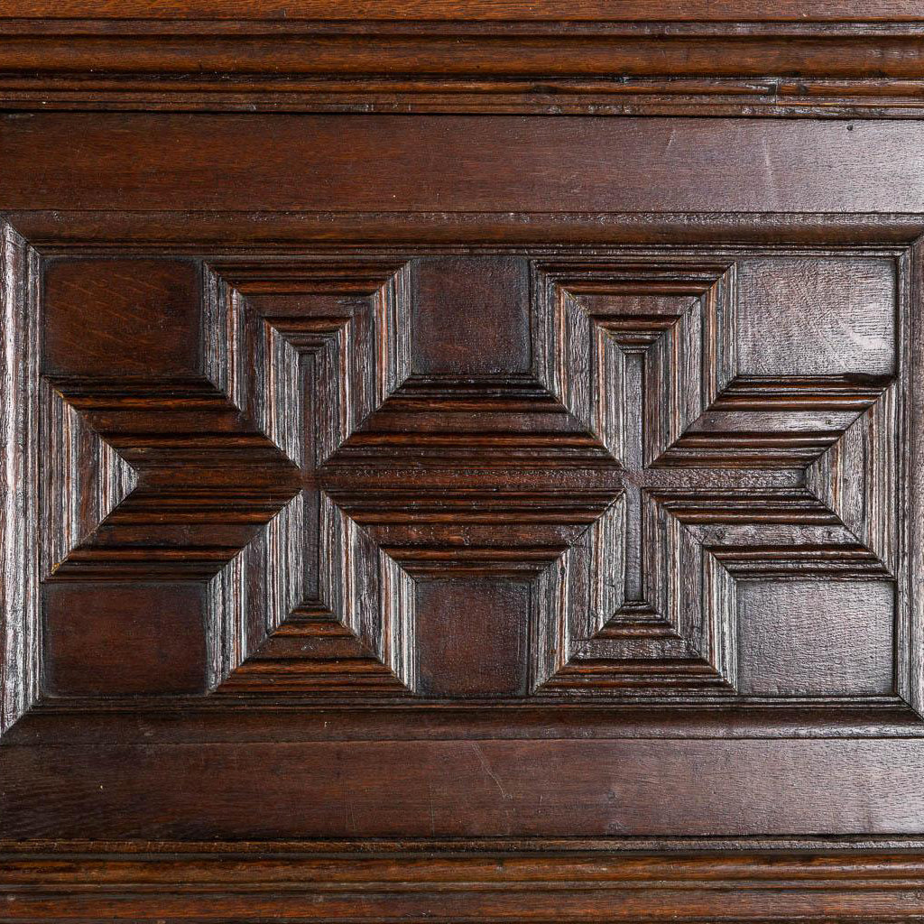 Impressive 18th century oak cabinet with geometric door facades from a fine antique dealer in Loudoun County