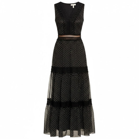 Black polka dot dress with sheer overlay on a white background