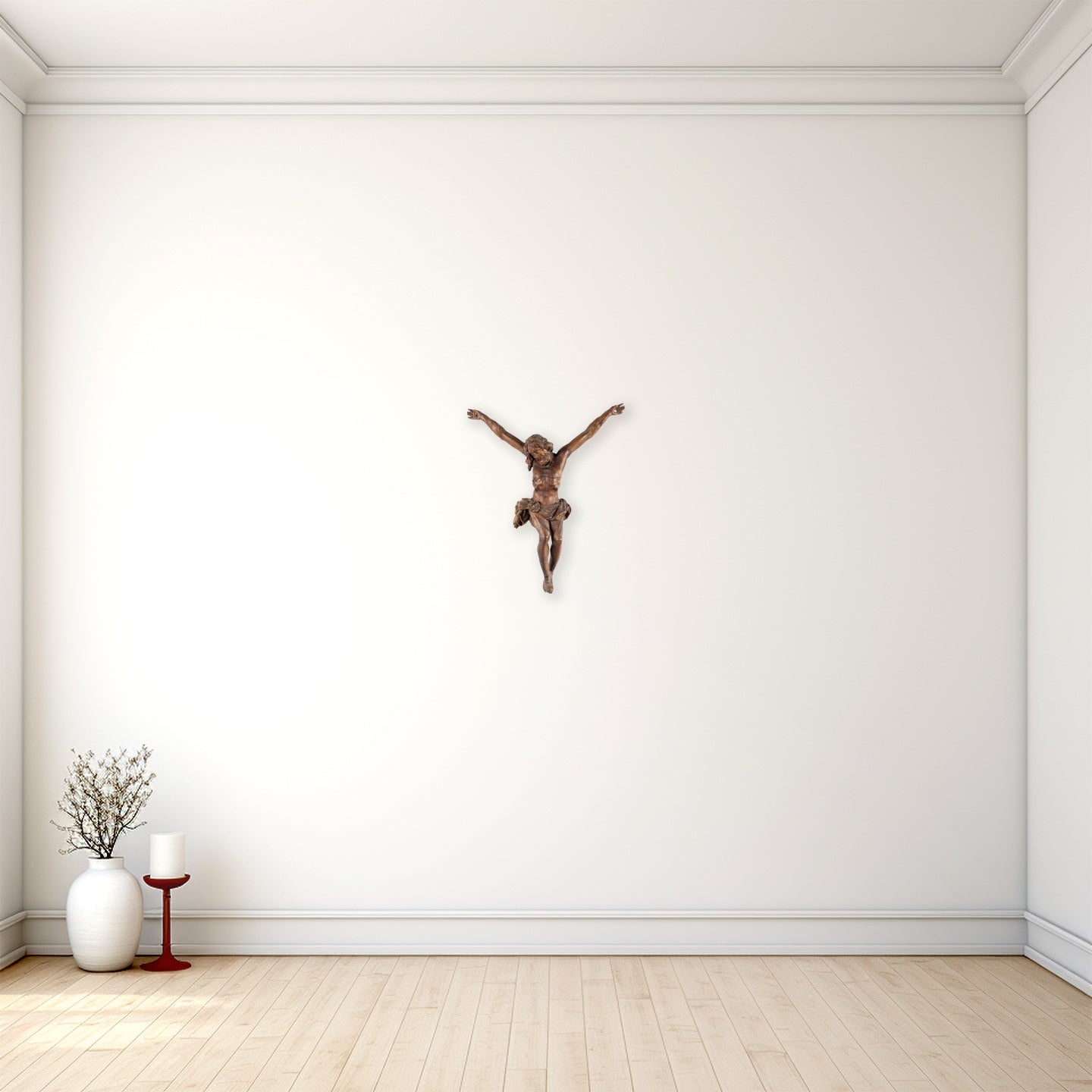 Wooden crucifix on a white wall with minimal decor