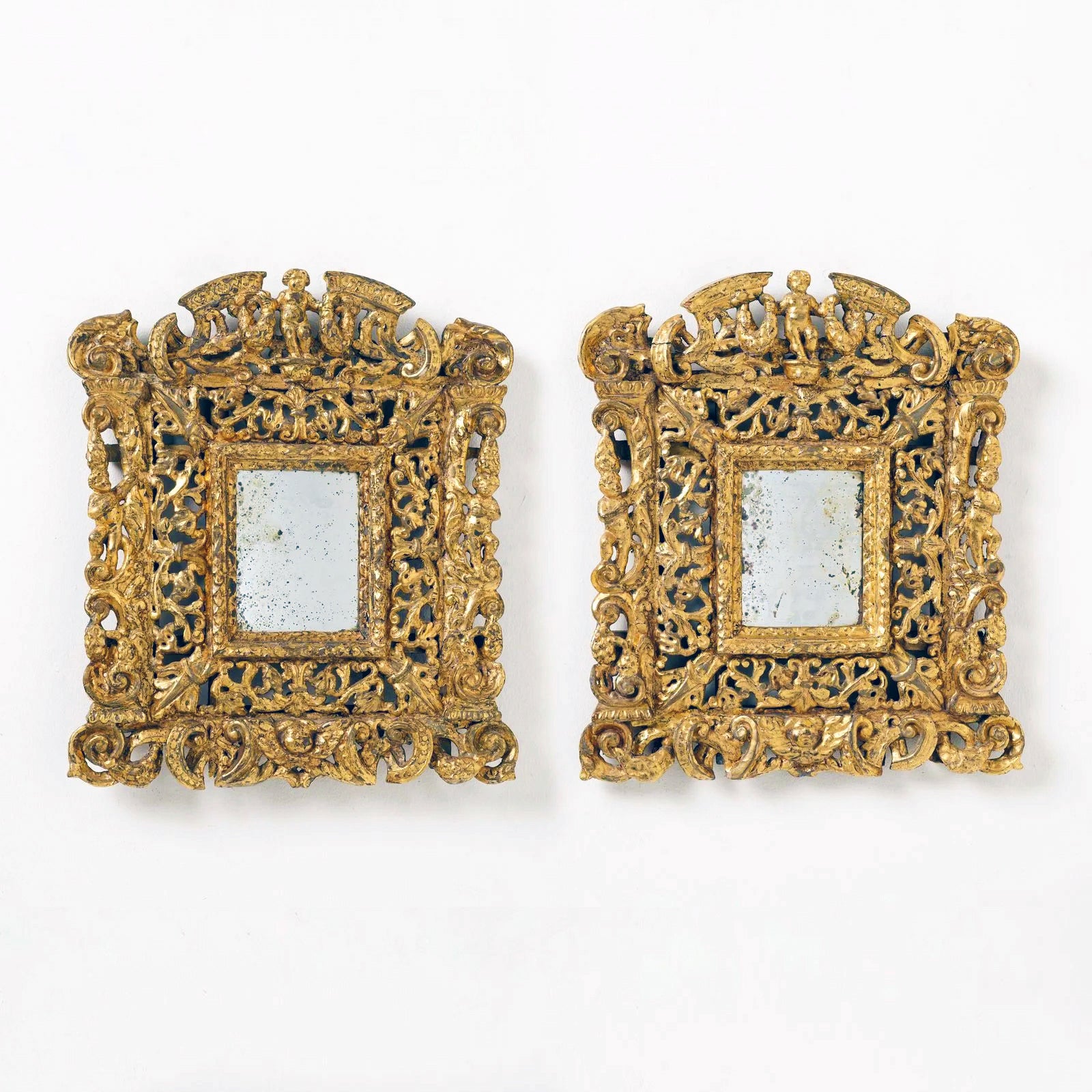 Pair of Elaborately Carved 19th century Giltwood Mirrors