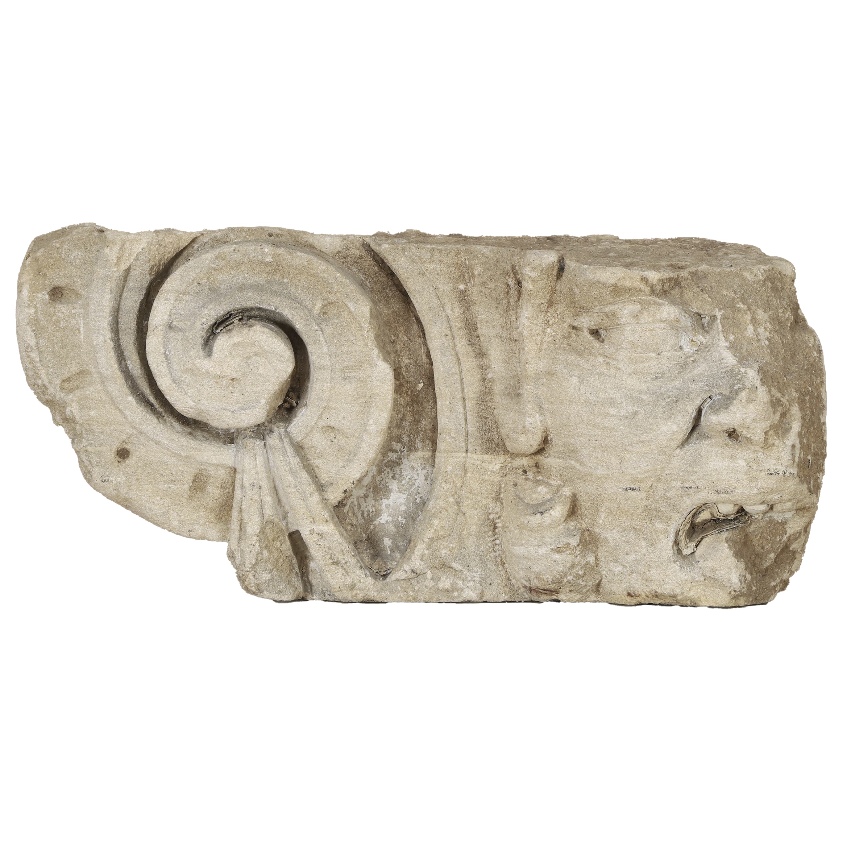16th-century French Renaissance carved Caen stone modillion fragment. Features a weathered Ionic volute scroll and a grimacing chimera grotesque face. A curated European architectural antique from Rouen.
