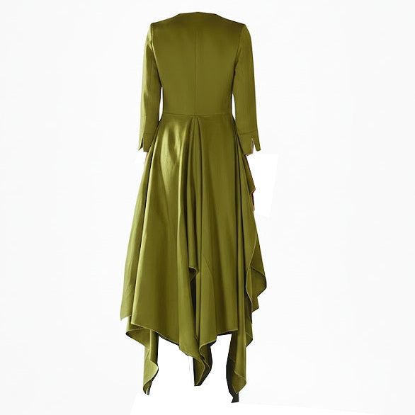 Green dress with long sleeves and an asymmetrical hem on a white background