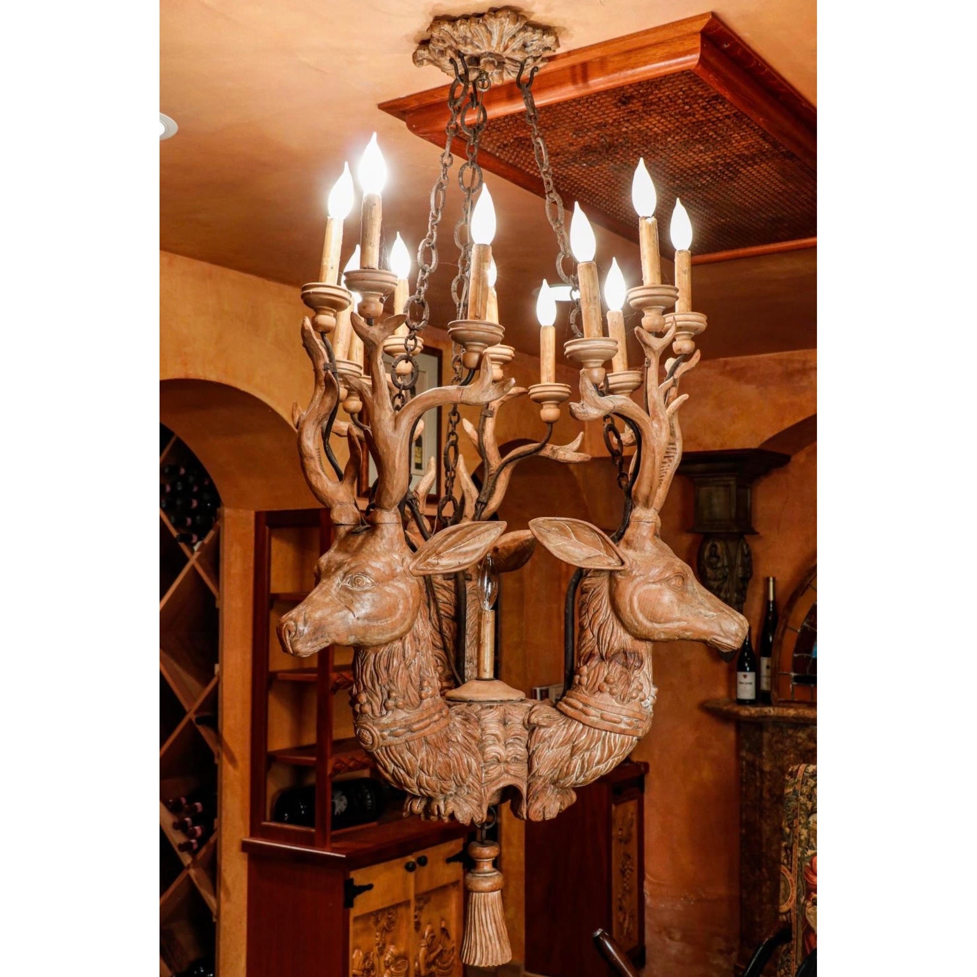 Decorative chandelier with deer heads in a rustic setting